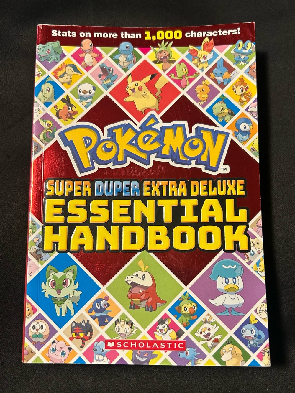 Pokรฉmon Super Duper Extra Deluxe Essential Handbook - Red